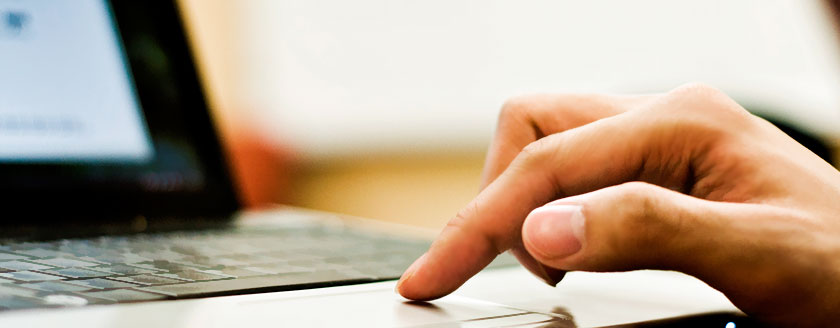 Finger On Laptop Keyboard Trackpad