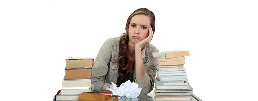 Girl At Desk Books Frustrated Head On Hands