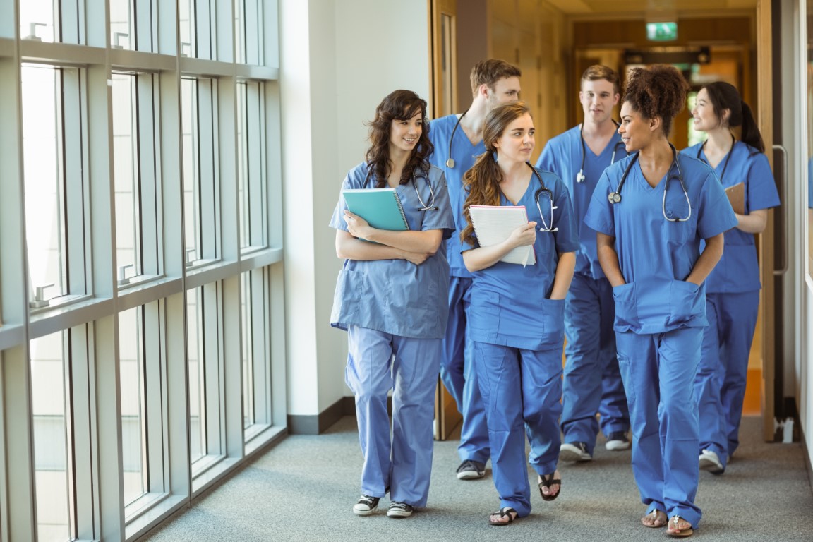 Medical students walking through corridor at the university MedicalStudents Walking Through Corridor
